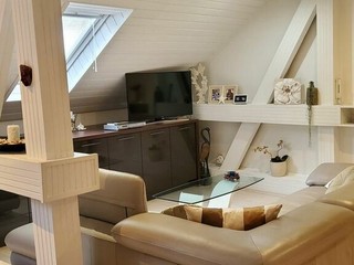 Spacious attic 3-bedroom apartment in a house with a terrace for rent in the Old Town